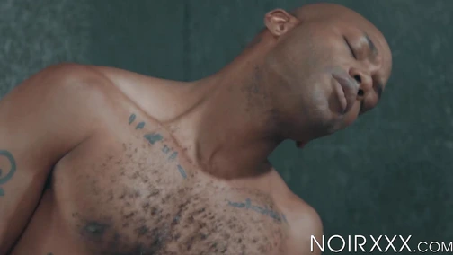 Tattooed jock Michael Roman willingly endures getting ravaged by a black dick