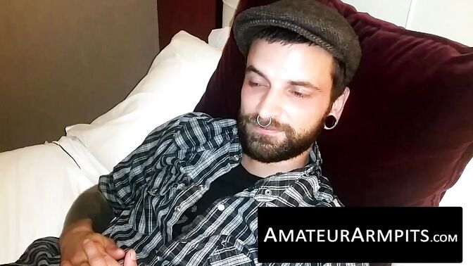 Nasty hipster dude strokes his bushy rod