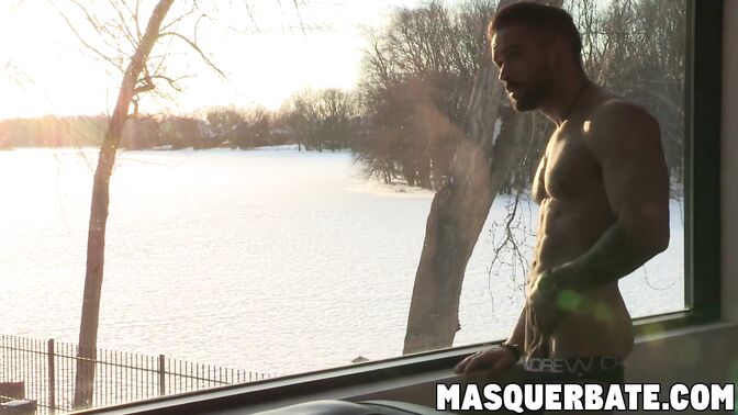 Muscular hunk plays with big dick solo