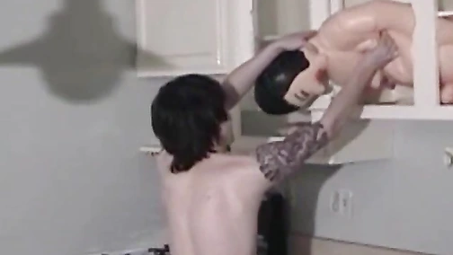 Tattooed cutie toys with his sex doll