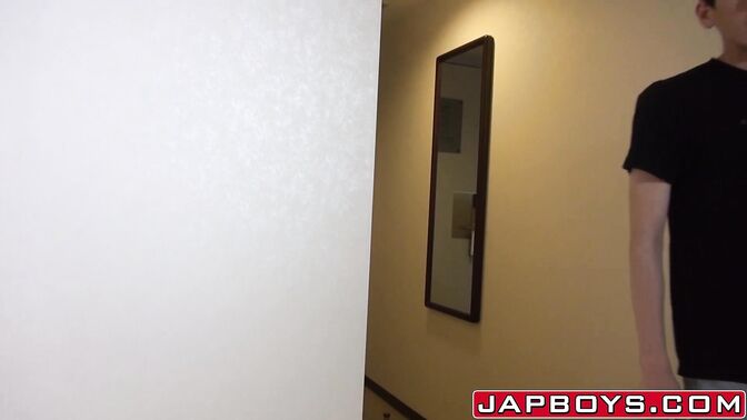 Asian twink working on his hard cock