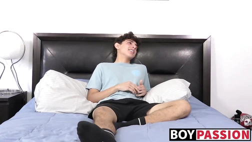 Curly twink stroking after an interview